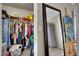 Walk-in closet with ample storage space, and view of a mirror and painting at 3150 Soft Breezes Dr # 1040, Las Vegas, NV 89128