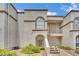 Charming condo featuring stucco siding, stairway access, and desert landscaping at 3150 Soft Breezes Dr # 1040, Las Vegas, NV 89128