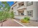 Condo patio featuring stucco siding, exterior storage, and desert landscaping at 3150 Soft Breezes Dr # 1040, Las Vegas, NV 89128