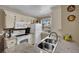 Kitchen with stainless steel sink, stone countertops, and bright window view at 3150 Soft Breezes Dr # 1040, Las Vegas, NV 89128