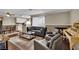 Comfortable living area with a gray sofa, matching armchairs, and a fireplace creating a cozy and inviting ambiance at 3150 Soft Breezes Dr # 1040, Las Vegas, NV 89128