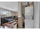 Open concept living area with a fireplace, modern furniture, and convenient washer-dryer closet at 3150 Soft Breezes Dr # 1040, Las Vegas, NV 89128