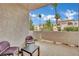 Outdoor patio with seating offering views of the community and blue skies at 3150 Soft Breezes Dr # 1040, Las Vegas, NV 89128