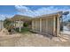 Backyard shows covered patio, gravel area, and lawn at 3220 W Hammer Ln, North Las Vegas, NV 89031