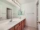 Well-lit bathroom featuring double sinks, a large mirror, and neutral tones at 3220 W Hammer Ln, North Las Vegas, NV 89031