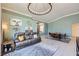 Stylish living room with comfortable seating, decor, and access to the dining area at 3220 W Hammer Ln, North Las Vegas, NV 89031