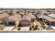 Bird's eye view of home with desert landscaping, solar panels, and convenient two-car garage at 3621 Jasmine Heights Ave, North Las Vegas, NV 89081