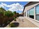 Well-maintained backyard with desert landscaping and a view of the house's exterior at 3621 Jasmine Heights Ave, North Las Vegas, NV 89081