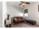 Bedroom featuring a futon, neutral tones, and ceiling fan, creating a cozy and inviting atmosphere at 3621 Jasmine Heights Ave, North Las Vegas, NV 89081