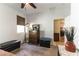 Cozy bedroom features a ceiling fan, window with blinds, and decorative furnishings at 3621 Jasmine Heights Ave, North Las Vegas, NV 89081