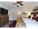 Spacious bedroom with neutral tones, ceiling fan, and easy access to the ensuite bathroom, ensuring comfort and convenience at 3621 Jasmine Heights Ave, North Las Vegas, NV 89081