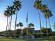 Community clubhouse surrounded by palm trees and well-manicured landscaping at 3621 Jasmine Heights Ave, North Las Vegas, NV 89081