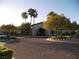 Attractive clubhouse exterior with mature landscaping, circular driveway, and desert plants at 3621 Jasmine Heights Ave, North Las Vegas, NV 89081