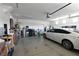 Spacious garage with ample storage space and a parked vehicle at 3621 Jasmine Heights Ave, North Las Vegas, NV 89081