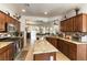 Open kitchen with granite countertops, stainless steel appliances, and seamless flow to living spaces at 3621 Jasmine Heights Ave, North Las Vegas, NV 89081