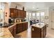 Inviting kitchen featuring granite counters, tile backsplash, and an adjacent dining area at 3621 Jasmine Heights Ave, North Las Vegas, NV 89081