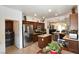 Spacious kitchen with granite countertops and stainless steel appliances, next to the laundry area at 3621 Jasmine Heights Ave, North Las Vegas, NV 89081