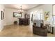 Living room with tile floor, wet bar and archway leading to the rest of the home at 3621 Jasmine Heights Ave, North Las Vegas, NV 89081