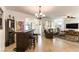 Spacious living room with tile flooring, wet bar, and an archway leading to other rooms at 3621 Jasmine Heights Ave, North Las Vegas, NV 89081