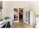 Office with glass door view of kitchen, tile floors, and modern furnishings at 3621 Jasmine Heights Ave, North Las Vegas, NV 89081