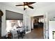 Bright home office space featuring a large window with view, ceiling fan and view into the home's living spaces at 3621 Jasmine Heights Ave, North Las Vegas, NV 89081