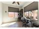 Bright office with large windows, modern furniture, and a view of the backyard at 3621 Jasmine Heights Ave, North Las Vegas, NV 89081