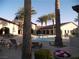 Community pool with lounge chairs shaded by palm trees at 3621 Jasmine Heights Ave, North Las Vegas, NV 89081