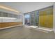 Sleek, modern kitchen with wood cabinets, stainless steel appliances, and large windows overlooking the city at 3726 Las Vegas Blvd # 1809, Las Vegas, NV 89158