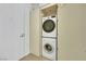 Stacked washer and dryer in utility closet with ample storage space at 3726 Las Vegas Blvd # 1809, Las Vegas, NV 89158