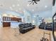 An open concept space featuring a living room, fireplace, modern lighting, and kitchen area at 3780 Shawnee Ave, Pahrump, NV 89048
