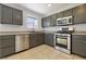 Bright kitchen with stainless steel appliances and a large window above the sink at 3961 Bayamon St, Las Vegas, NV 89129