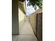 Cement pathway between house and block wall, perfect for side yard access at 4113 Arcola Ave, Las Vegas, NV 89110
