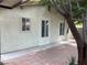 Paver patio with shade trees lining the house at 4113 Arcola Ave, Las Vegas, NV 89110