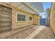 Back patio featuring brick pavers and an overhead pergola at 4611 Four Leaf Clover Dr, Las Vegas, NV 89122