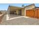 Backyard with gravel, a covered patio, and gated access at 4611 Four Leaf Clover Dr, Las Vegas, NV 89122