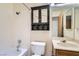 Bathroom featuring shower-tub, vanity, and a decorative medicine cabinet at 4611 Four Leaf Clover Dr, Las Vegas, NV 89122