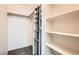Organized closet with shelves and a hanging organizer for optimal storage at 4611 Four Leaf Clover Dr, Las Vegas, NV 89122