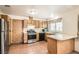 Efficient kitchen with appliances, light wood cabinets and tile flooring at 4611 Four Leaf Clover Dr, Las Vegas, NV 89122