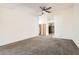 Bright living room featuring neutral walls and carpet at 4611 Four Leaf Clover Dr, Las Vegas, NV 89122