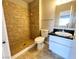 Tiled bathroom featuring a shower and vanity with granite top at 4766 Knollwood Dr, Las Vegas, NV 89147