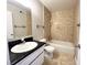 Neutral bathroom with a black countertop and tile at 4766 Knollwood Dr, Las Vegas, NV 89147