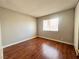 Bedroom with hardwood floors, baseboards and window at 4766 Knollwood Dr, Las Vegas, NV 89147