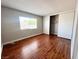 Bedroom featuring wood-look floors, a window and closet at 4766 Knollwood Dr, Las Vegas, NV 89147