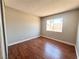 Bedroom with hardwood floors and natural light from the window at 4766 Knollwood Dr, Las Vegas, NV 89147