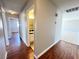 Hallway with hardwood floors leading to bedrooms and a bathroom at 4766 Knollwood Dr, Las Vegas, NV 89147