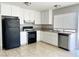Well-lit kitchen featuring modern appliances, tile floor, and ample cabinet space at 4766 Knollwood Dr, Las Vegas, NV 89147