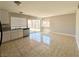 Bright kitchen area with sliding glass door, tile flooring, and ample counter space at 4766 Knollwood Dr, Las Vegas, NV 89147