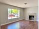 Bright living room featuring laminate flooring, fresh paint, and natural light at 4766 Knollwood Dr, Las Vegas, NV 89147