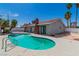 Backyard featuring sparkling pool, a red tile roof, and mature trees at 4813 Plata Del Sol, Las Vegas, NV 89121