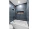 Stylish bathroom featuring a modern tub and shower with updated fixtures at 4813 Plata Del Sol, Las Vegas, NV 89121